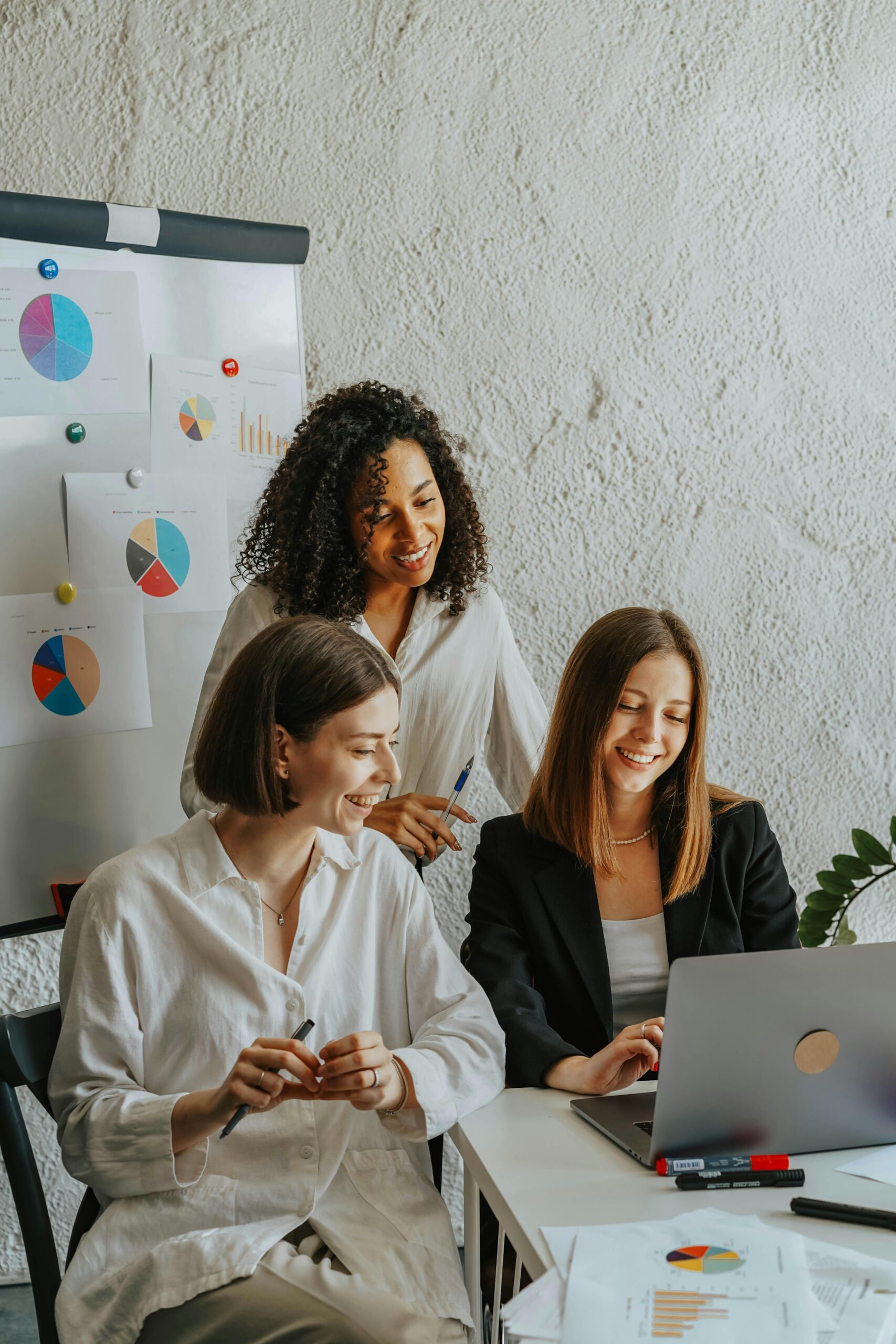 three girls discussing local listing strategies